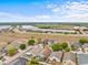 Aerial view of a neighborhood with single-Gathering homes and a clear blue sky at 438 Cotswold Cir, Davenport, FL 33837