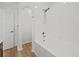 Bathroom showcasing a tub with tiled wall and showerhead at 438 Cotswold Cir, Davenport, FL 33837