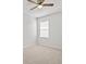 Bedroom featuring neutral carpet, a ceiling fan, and a window at 438 Cotswold Cir, Davenport, FL 33837