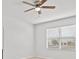 Bedroom featuring a ceiling fan and a large window with blinds allowing natural light at 438 Cotswold Cir, Davenport, FL 33837