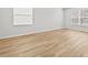 Well-lit room with wood floors and bright white walls and trim at 438 Cotswold Cir, Davenport, FL 33837