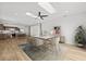 Open-concept room with hardwood flooring, a modern kitchen and a dining area at 438 Cotswold Cir, Davenport, FL 33837
