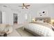 Spacious main bedroom featuring a cozy bed, and a seating area with lots of natural light at 438 Cotswold Cir, Davenport, FL 33837