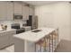 Modern kitchen with stainless steel appliances, spacious island, and subway tile backsplash at 5880 Meditation Dr, Clermont, FL 34714