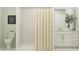 Bright bathroom featuring a stylish vanity, tiled shower, and a modern toilet at 1311 Blue Ash Ln, Deland, FL 32720
