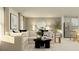 Inviting living area with a plush sofa, modern decor, and a view of the kitchen at 1311 Blue Ash Ln, Deland, FL 32720