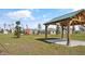 Community pavilion overlooking the playground and nearby residences provides a shady gathering spot at 1366 Blue Ash Ln, Deland, FL 32720