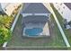 Aerial image of a beautiful house with screened-in pool and fenced backyard at 16755 Sunrise Vista Dr, Clermont, FL 34714