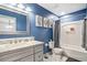 Stylish bathroom boasting a marble countertop vanity and a shower-tub combo at 16755 Sunrise Vista Dr, Clermont, FL 34714