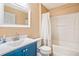 Well-maintained bathroom featuring a vanity sink, toilet, and a bathtub with a shower at 16755 Sunrise Vista Dr, Clermont, FL 34714