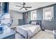 Relaxing bedroom showcasing a fan, two windows, and soft carpet at 16755 Sunrise Vista Dr, Clermont, FL 34714