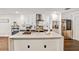 Modern kitchen with white countertops, dark base cabinets, stainless steel appliances, and subway tile backsplash at 16755 Sunrise Vista Dr, Clermont, FL 34714