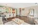 Open living room and dining room with wood floors, neutral paint, and staircase at 16755 Sunrise Vista Dr, Clermont, FL 34714