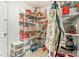 Well-organized pantry stocked with ample storage shelves for food items and household supplies at 16755 Sunrise Vista Dr, Clermont, FL 34714