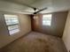 Bedroom featuring a ceiling fan and two windows at 1831 Quail Trl, Lakeland, FL 33810