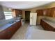 Kitchen with plenty of cabinet space, standard appliances, and updated flooring at 1831 Quail Trl, Lakeland, FL 33810