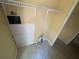 Functional laundry room with shelving, laminate floors and utility connections at 1831 Quail Trl, Lakeland, FL 33810