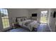 Serene bedroom with a comfortable bed, soft lighting, and large windows at 25322 Columbia Cir, Lake Wales, FL 33898