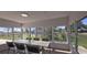Bright dining room with large windows providing natural light and views of the outdoors at 25322 Columbia Cir, Lake Wales, FL 33898