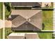 Aerial view shows the roof of the home, manicured lawn and fencing at 2846 Sera Bella Way, Kissimmee, FL 34744