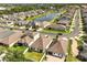 Aerial view of the community showcasing homes, pond and landscaping at 2846 Sera Bella Way, Kissimmee, FL 34744