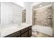 Clean bathroom features shower-tub combo, tile floors, and large mirror at 2846 Sera Bella Way, Kissimmee, FL 34744