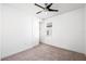 Bright bedroom features neutral carpet, ceiling fan, window, and closet at 2846 Sera Bella Way, Kissimmee, FL 34744