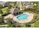 Aerial view of community pool with lounge chairs and seating in covered gazebo at 2846 Sera Bella Way, Kissimmee, FL 34744
