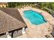 Community pool with a view of lounge chairs and covered patio at 2846 Sera Bella Way, Kissimmee, FL 34744