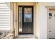 Close-up of a modern front door with glass panels and stylish accents at 2846 Sera Bella Way, Kissimmee, FL 34744