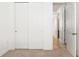 Hallway outside bedroom features closet and tile floors at 2846 Sera Bella Way, Kissimmee, FL 34744