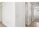 Clean hallway features tile floors and open doorway at 2846 Sera Bella Way, Kissimmee, FL 34744
