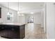 Open kitchen layout with a center island and seamless flow to the living area at 2846 Sera Bella Way, Kissimmee, FL 34744