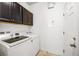 Laundry room features washer and dryer hookups, and cabinet storage at 2846 Sera Bella Way, Kissimmee, FL 34744