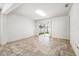Bright living room featuring tile floors and sliding glass doors to the outdoor patio at 2846 Sera Bella Way, Kissimmee, FL 34744