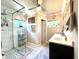 Modern bathroom featuring a glass-enclosed shower, ample lighting, and updated fixtures at 1464 Mount Pleasant Rd, Groveland, FL 34736
