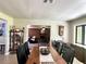 Spacious dining room with views into the living room, featuring tile floors throughout at 1464 Mount Pleasant Rd, Groveland, FL 34736
