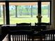 Dining area featuring a large picture window with views of trees at 1464 Mount Pleasant Rd, Groveland, FL 34736