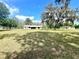 Charming single-story home with a well-manicured lawn and mature trees in a serene setting at 1464 Mount Pleasant Rd, Groveland, FL 34736