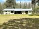 Charming single story home with metal roof, offering outdoor living with its screened-in patio at 1464 Mount Pleasant Rd, Groveland, FL 34736