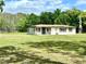Charming home featuring a well-manicured lawn and a welcoming facade at 1464 Mount Pleasant Rd, Groveland, FL 34736