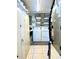 Functional laundry area featuring washer, dryer, ample shelving and storage for efficient household tasks at 1464 Mount Pleasant Rd, Groveland, FL 34736