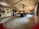 Expansive office area with multiple seating and work areas and a fireplace, perfect for a variety of creative projects at 1464 Mount Pleasant Rd, Groveland, FL 34736