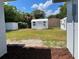 View of backyard featuring outdoor sheds for storage and lawn area, offering functional outdoor space at 213 5Th Jpv St, Winter Haven, FL 33880