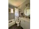 Updated bathroom with a shower-tub combo, modern fixtures, and grey tile at 213 5Th Jpv St, Winter Haven, FL 33880