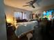 Bedroom featuring a full-size bed with a ceiling fan and window for ample light at 213 5Th Jpv St, Winter Haven, FL 33880