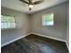 Comfortable bedroom featuring a ceiling fan and natural light from multiple windows and finished flooring at 213 5Th Jpv St, Winter Haven, FL 33880