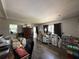 Living room area with desk, shelving, and an abundance of natural light at 213 5Th Jpv St, Winter Haven, FL 33880