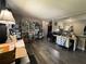 Spacious living room featuring dark laminate flooring and ample space for decor and furniture at 213 5Th Jpv St, Winter Haven, FL 33880
