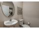 Cozy powder room showcasing a pedestal sink and modern decor at 3856 King Hill Dr, Haines City, FL 33844